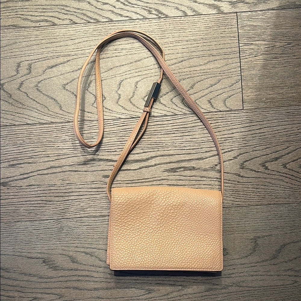 Peach pink Leather Crossbody Bag
Aritzia 
Claps work 
Length is changeable.